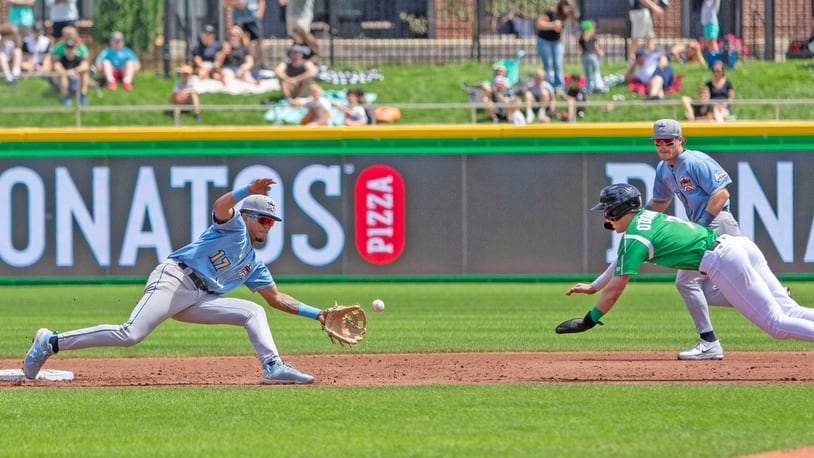 Dayton outfielder Ethan O'Donnell steals second base in the third inning Sunday at Day Air Ballpark as the throw eludes Lake County shortstop Angel Genao. Jeff Gilbert/CONTRIBUTED