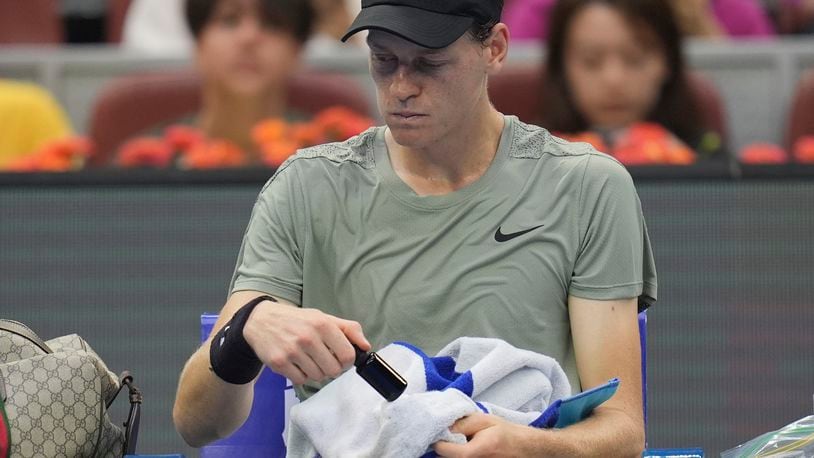 Italy's Jannick Sinner rests between sets against Roman Safiullin of Russia during the China Open tennis tournament held at the National Tennis Center in Beijing, Saturday, Sept. 28, 2024. (AP Photo/Ng Han Guan)