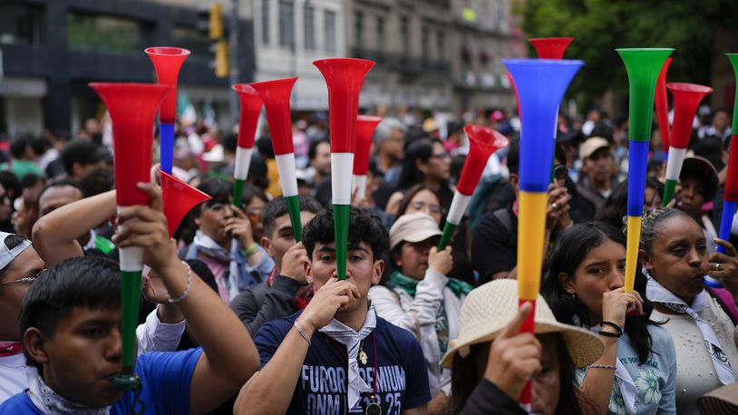 People blows vuvuzelas during a rally in favor of the government's proposed judicial reform outside the Supreme Court building in Mexico City, Thursday, Sept. 5, 2024. (AP Photo/Eduardo Verdugo)