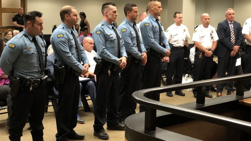 The six officers who stopped the Oregon District shooter within about 32 seconds of his first shot were honored this week by Dayton police and city leadership. The officers, from left, are Ryan Nabel, Brian Rolfes, David Denlinger, Jeremy Campbell and Vincent Carter. Sgt. William C. Knight, not pictured, also responded. CORNELIUS FROLIK / STAFF