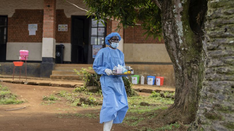 A health worker carries medication to be giving to a man suffering for mpox at the Kamituga General Hospital in South Kivu Congo, Wednesday, Sept. 4, 2024. (AP Photo/Moses Sawasawa)