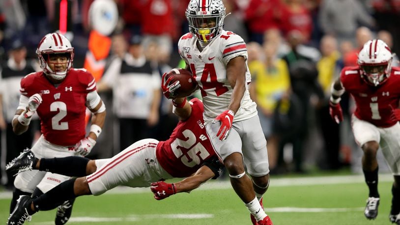 INDIANAPOLIS, INDIANA - DECEMBER 07: K.J. Hill #14 of the Ohio State Buckeyes runs the ball in for touchdown in the Big Ten Championship game against the Wisconsin Badgers during the third quarter at Lucas Oil Stadium on December 07, 2019 in Indianapolis, Indiana. (Photo by Justin Casterline/Getty Images) ***BESTPIX***