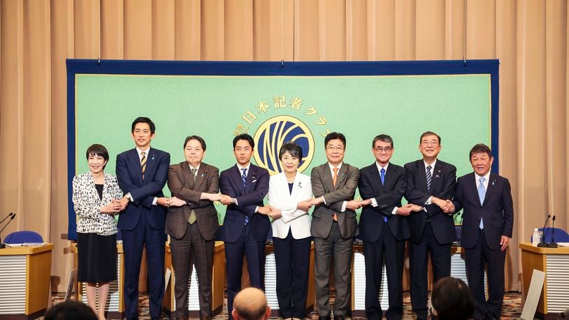 FILE - Candidates for Japan's ruling Liberal Democratic Party's (LDP) presidential election pose for a photo before a debate at the Japan National Press Club in Tokyo, on Sept. 14, 2024. From left are Economic Security Minister Sanae Takaichi, former Economic Security Minister Takayuki Kobayashi, Chief Cabinet Secretary Yoshimasa Hayashi, former Environment Minister Shinjiro Koizumi, Foreign Minister Yoko Kamikawa, former Chief Cabinet Secretary Katsunobu Kato, Digital Minister Taro Kono, former Defense Minister Shigeru Ishiba and Liberal Democratic Party Secretary General Toshimitsu Motegi. (Takashi Aoyama/Pool Photo via AP, File)