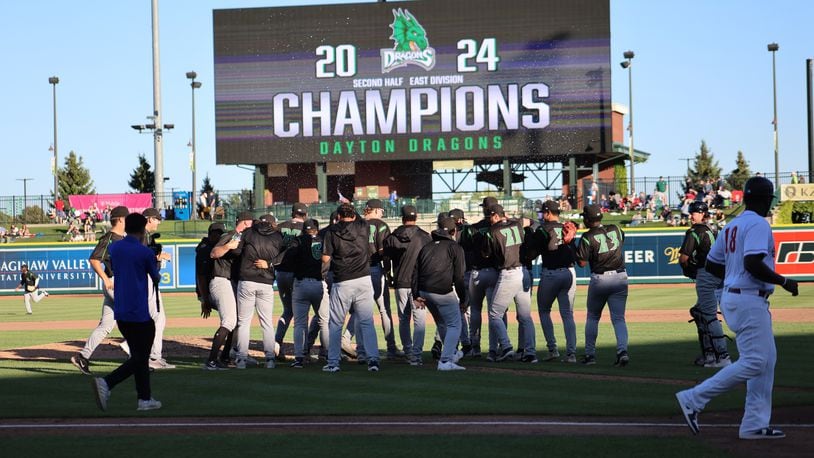 The Dayton Dragons celebrate moments after beating Great Lakes to clinch a playoff berth for the first time since 2017 with a 1-0 win on Sept. 2, 2024. The Dragons, the Midwest League East Division second-half champions, will host a first-round playoff game on Tuesday at Day Air Ballpark. CONTRIBUTED