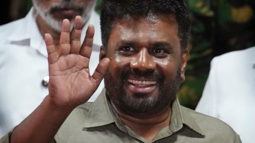 FILE -Marxist lawmaker Anura Kumara Dissanayake waves as he leaves from the election commission office after winning Sri Lankan presidential election, in Colombo, Sri Lanka, Sept. 22, 2024. (AP Photo/Rajesh Kumar Singh, File)