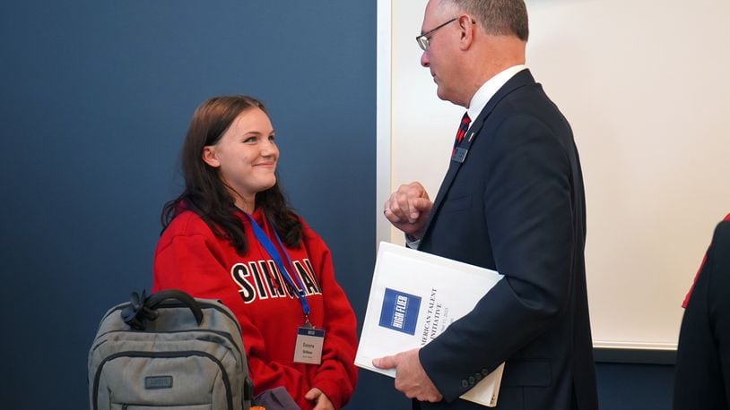 Jasmine Roberts, one of the first students in the University of Dayton’s Kessler Scholars Program, with University of Dayton President Eric Spina. (CONTRIBUTED)