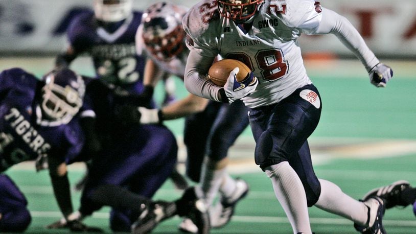 Piqua’s Brandon Saine (28) runs in for a touchdown against Pickerington Central in the second quarter, in the Division II high school championship football game at Paul Brown Tiger Stadium, Friday, Dec. 1, 2006, in Massillon, Ohio. (AP Photo/Tony Dejak)