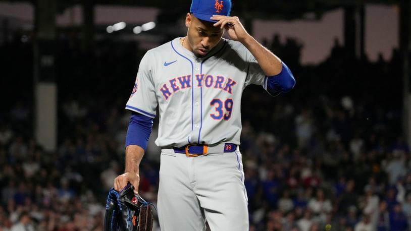 New York Mets relief pitcher Edwin Díaz reacts after being ejected by their base umpire Vic Carapazza during the ninth inning of a baseball game against the Chicago Cubs in Chicago, Sunday, June 23, 2024. (AP Photo/Nam Y. Huh)