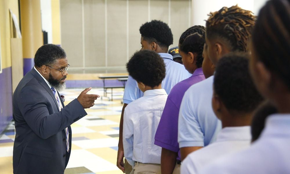 Dayton Boys Prep Academy Principal Therman Sampson II talks to students about school procedures. TY GREENLEES / STAFF