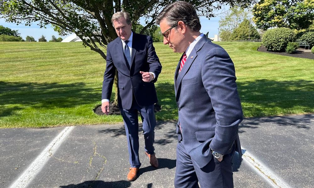 House Speaker Mike Johnson, R-La. (right), and U.S. Rep. Mike Turner, R-Dayton, prepare to speak to the media Friday just outside Wright-Patterson Air Force Base at the Hope Hotel and Conference Center. THOMAS GNAU/STAFF