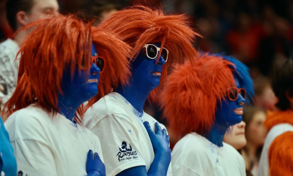 Dayton fans in the Red Scare student section stand for the national anthem before a game against Duquesne on Tuesday, Feb. 13, 2024, at UD Arena. David Jablonski/Staff