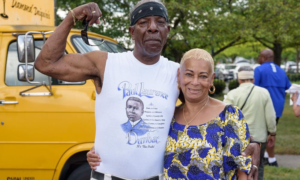 Kevin Rakestraw & Marsha Robinson of Dayton at the fifth annual Wright Dunbar Day Block Party on Sunday, June 23, 2024. Kevin is wearing a Paul Laurence Dunbar t-shirt designed by Dayton artist Reginald Harmon. TOM GILLIAM / CONTRIBUTING PHOTOGRAPHER