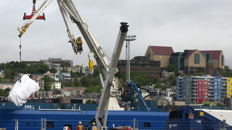 FILE - Debris from the Titan submersible, recovered from the ocean floor near the wreck of the Titanic, is unloaded from the ship Horizon Arctic at the Canadian Coast Guard pier in St. John's, Newfoundland, June 28, 2023. (Paul Daly/The Canadian Press via AP, File)