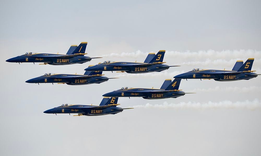 The U.S. Navy Blue Angels fly in formation as they arrive in Dayton Wednesday, June 19, 2024, ahead of the CenterPoint Energy Dayton Air Show this weekend at the Dayton International Airport. MARSHALL GORBY\STAFF