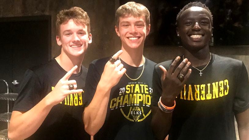 From left, Centerville seniors Kyle Kenney, Gabe Cupps and Emmanuel Deng show off the state championship rings they won as sophomores in 2021. CONTRIBUTED