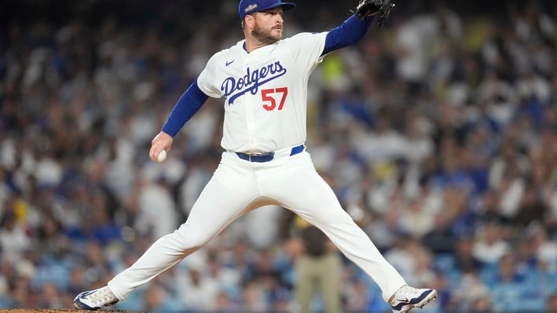 Los Angeles Dodgers pitcher Ryan Brasier throws to a San Diego Padres batter during the eighth inning in Game 2 of a baseball NL Division Series, Sunday, Oct. 6, 2024, in Los Angeles. (AP Photo/Ashley Landis)