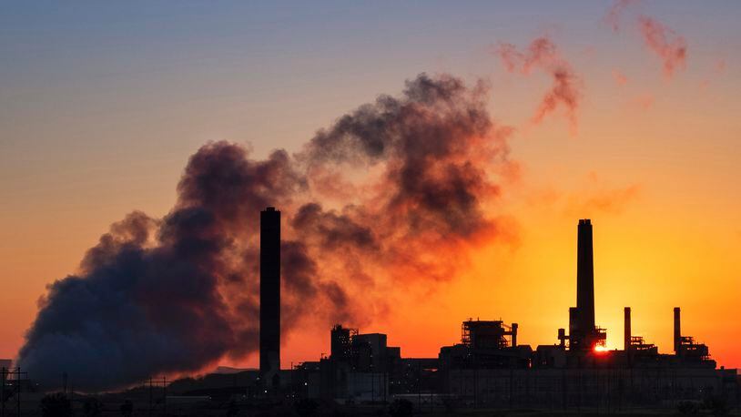 File - A coal-fired power plant is silhouetted against the morning sun on July 27, 2018, in Glenrock, Wyo. A climate philanthropy organization, Giving Green, received a $10 million anonymous donation in April, 2024, and thinks that the same donor may have given even more. (AP Photo/J. David Ake, File)