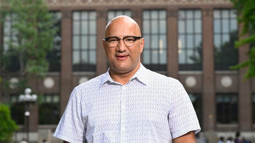 Jerusalem Garden restaurant owner and operator Ali Ramlawi stands on the campus of the University of Michigan, Thursday, Aug. 29, 2024, in Ann Arbor, Mich. (AP Photo/Jose Juarez)