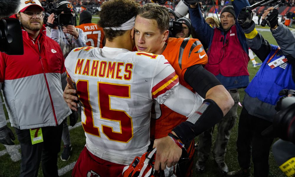 Cincinnati Bengals quarterback Joe Burrow (9) meets with Kansas City Chiefs quarterback Patrick Mahomes (15) following an NFL football game in Cincinnati, Fla., Sunday, Dec. 4, 2022. The Bengals defeated the Chief 27-24. (AP Photo/Jeff Dean)