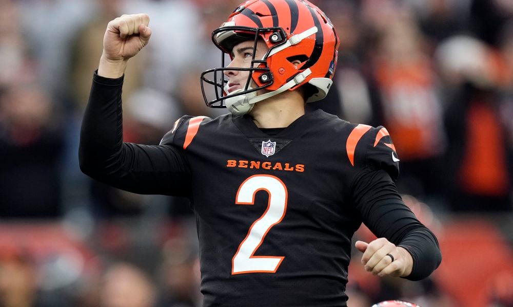 Cincinnati Bengals place kicker Evan McPherson (2) reacts as he kicks the game-winning field goal in overtime of an NFL football game against the Minnesota Vikings Saturday, Dec. 16, 2023, in Cincinnati. (AP Photo/Carolyn Kaster)