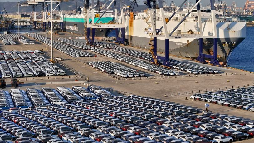 FILE - New cars for export wait for transportation on a vehicles carrier vessel at a dockyard in Yantai in east China's Shandong province on Nov. 2, 2023. Chinese auto sales slumped in June, 2024 as the domestic economy remains weak, but strong exports kept overall sales growth in positive territory, an industry association said Wednesday, July 10, 2024. (Chinatopix via AP, File)