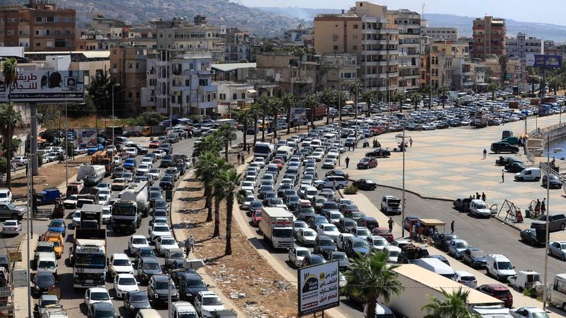 Cars sit in traffic as they flee the southern villages amid ongoing Israeli airstrikes, in Sidon, Lebanon, Monday, Sept. 23, 2024. (AP Photo/Mohammed Zaatari)