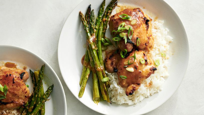 This photo shows Miso-Honey Chicken and Asparagus, a quick and easy sheet-pan meal that is broiled instead of baked, which chars the marinade slightly on the chicken, browns the asparagus for maximum flavor and cuts the cooking time to around 10 minutes.  (David Malosh/The New York Times)