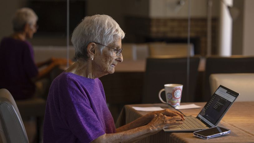 Barbara Winston uses a computer at her home in Northbrook, Ill., on Sunday, June 30, 2024, several days after taking an introduction to artificial intelligence class at a local senior center. “I saw ice boxes turn into refrigerators, that is how long I have been around, ... And I think [AI] is probably the greatest technical revolution that I will see in my lifetime,” she says. (AP Photo/Teresa Crawford)