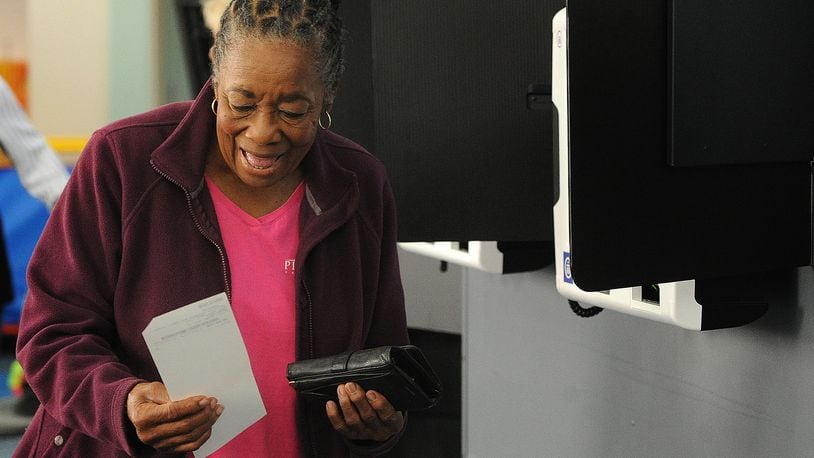 Gloria Payne, 79, casts her ballot on Tuesday Aug. 8 2023 at a Dayton-area polling location. She said she votes in every election because she remembers hearing from her mother about a time where every citizen couldn't vote. MARSHALL GORBY\STAFF