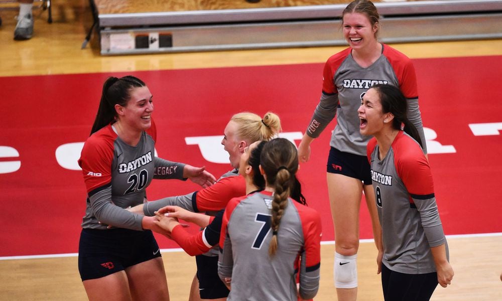 Dayton volleyball celebrates a point against Duquesne on Oct. 24, 2023, at the Frericks Center. Photo by Erik Schelkun