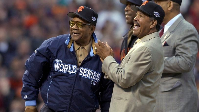 FILE - Willie Mays, left, is joined by former San Francisco Giants' Orlando Cepeda, right, Willie McCovey and Juan Marichal, front, before Game 3 of the World Series between the Giants and the Anaheim Angels in San Francisco,Oct. 22, 2002. Mays, the electrifying “Say Hey Kid” whose singular combination of talent, drive and exuberance made him one of baseball’s greatest and most beloved players, has died. He was 93. Mays' family and the San Francisco Giants jointly announced Tuesday night, June 18, 2024, he had “passed away peacefully” Tuesday afternoon surrounded by loved ones. (AP Photo/Kevork Djansezian, File)
