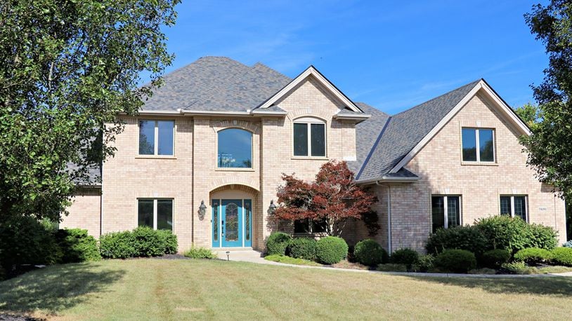 Listed for $850,000 by eXp Realty, the house at 7691 Deer Path Court in Clearcreek Twp. has about 4,314 square feet of living space. The 1.12-acre property includes a garden barn, a four-car garage and an in-ground swimming pool with slide and concrete patio deck. Part of the tree-lined back yard is surrounded by a metal fence and a concrete driveway leads up to the divided four-car garage with storage and workshop space. CONTRIBUTED