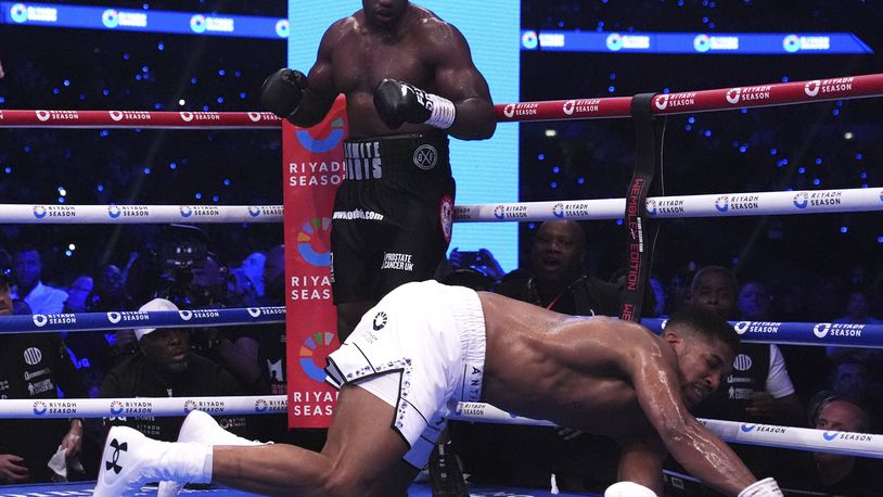 Daniel Dubois, left, knocks out Anthony Joshua in the IBF World Heavyweight bout at Wembley Stadium, in London, Saturday, Sept. 21, 2024. (Bradley Collyer/PA via AP)