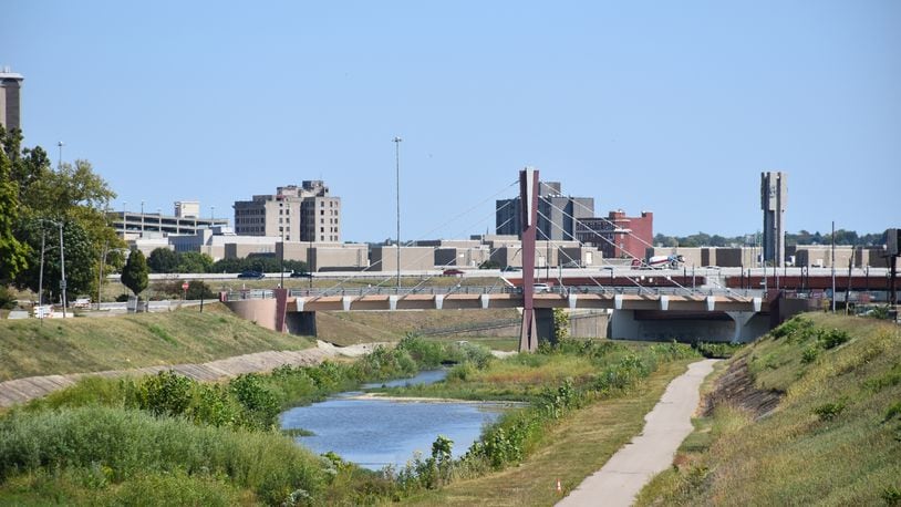 The city of Dayton plans to redesign parts of the levee flood protection systems on either side of Wolf Creek. CORNELIUS FROLIK / STAFF