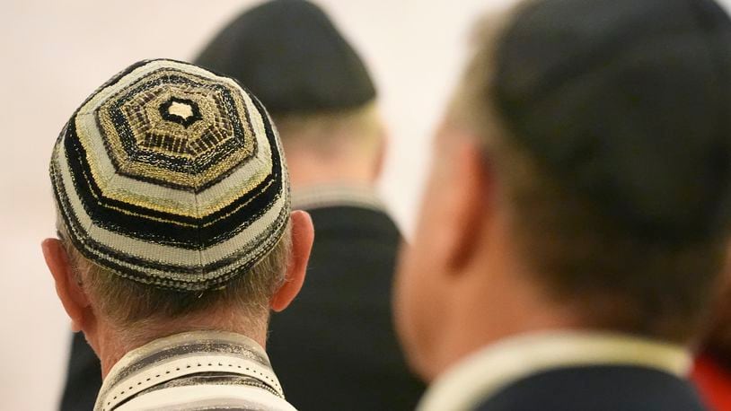 Men wear yarmulkes as they attend a Shabbat service, Friday, Sept. 27, 2024, at Temple Beth Sholom in Miami Beach, Fla. (AP Photo/Wilfredo Lee)