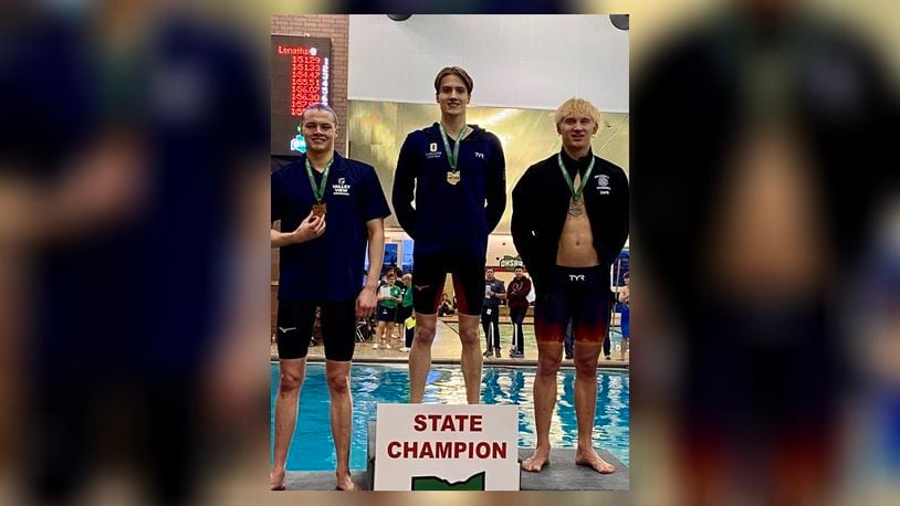 Oakwood senior Tristan Prizler (center) won a pair of Division II championships at the state swim meet at C.T. Branin Natatorium in Canton. CONTRIBUTED