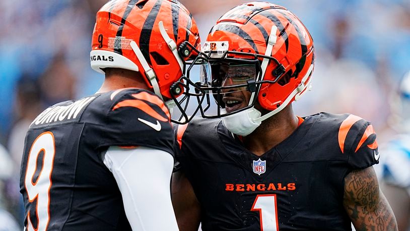 Cincinnati Bengals wide receiver Ja'Marr Chase celebrates after scoring with quarterback Joe Burrow against the Carolina Panthers during the first half of an NFL football game, Sunday, Sept. 29, 2024, in Charlotte, N.C. (AP Photo/Rusty Jones)