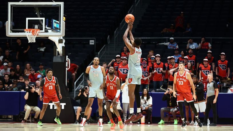 Andre Wesson, of Carmen's Crew, makes the game-clinching Elam Ending shot against Red Scare in the second round of The Basketball Tournament on Monday, July 22, 2024, at UD Arena. David Jablonski/Staff