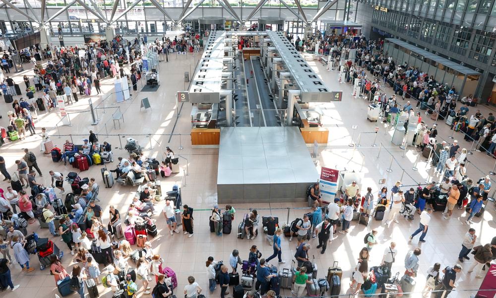 Travelers wait in Terminal 1 for check-in at Hamburg Airport, in Hamburg, Germany, Friday July 19, 2024. A widespread Microsoft outage disrupted flights, banks, media outlets and companies around the world on Friday. (Bodo Marks/dpa via AP)