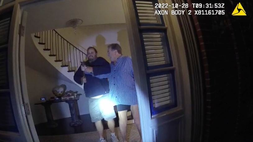 FILE - In this image taken from San Francisco Police Department body camera video, the husband of former U.S. House Speaker Nancy Pelosi, Paul Pelosi, right, fights for control of a hammer with his assailant, David DePape, during a brutal attack in the couple's San Francisco home, Oct. 28, 2022. DePape, who bludgeoned Nancy Pelosi’s husband with a hammer and was sentenced to 30 years in federal court, was also convicted Friday, June 21, 2024, of aggravated kidnapping by a state court which could put him behind bars for life. (San Francisco Police Department via AP, File)