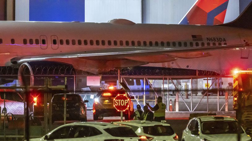 Multiple Atlanta Fire Rescue Department units and police park outside a Delta Maintenance facility near Hartsfield-Jackson International Airport early Tuesday, Aug. 27, 2024 in Atlanta. (John Spink/Atlanta Journal-Constitution via AP)