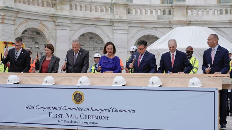 Congress members hammer in the first nails at the First Nail Ceremony marking the beginning of construction of the 2025 Presidential Inauguration platform on the steps of the Capitol, Wednesday, Sept. 18, 2024, in Washington. (AP Photo/Mariam Zuhaib)