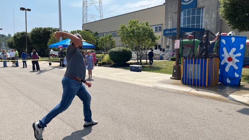 Dayton electric utility AES Ohio and the United Way celebrated an enduring partnership Wednesday. Among the fun activities: a dunking booth on the parking lot of AES Ohio's Dryden Road operations center. THOMAS GNAU/STAFF