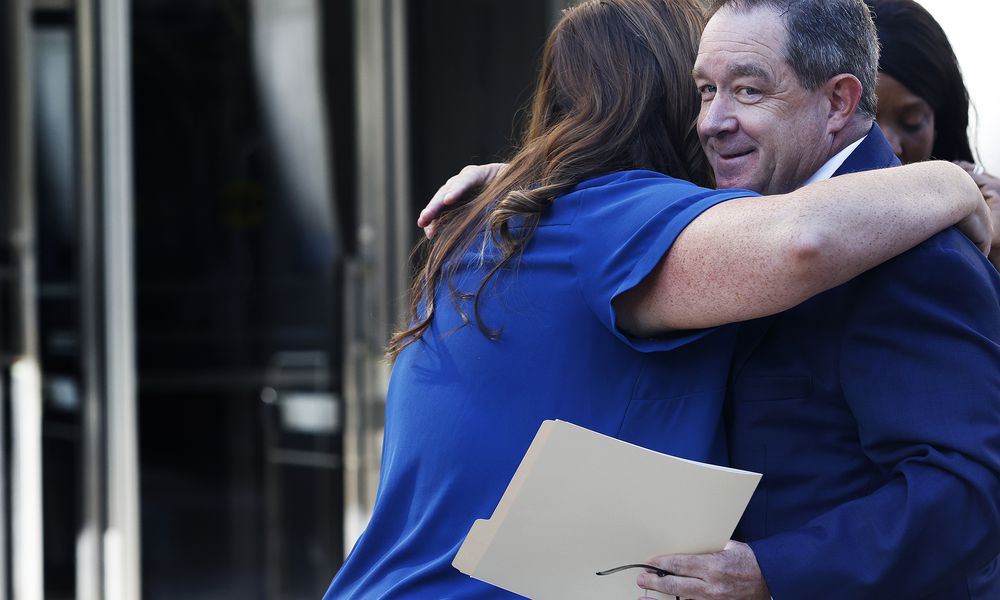 Montgomery County Clerk of Courts Mike Foley receives a hug Thursday, Sept. 12, 2024 from a staff member after his press conference at the Montgomery County Courthouse. MARSHALL GORBY\STAFF