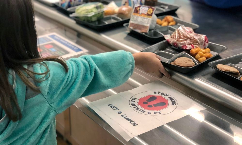 A second grader at Cline Elementary in Centerville gets served lunch. File photo from Centerville Schools.