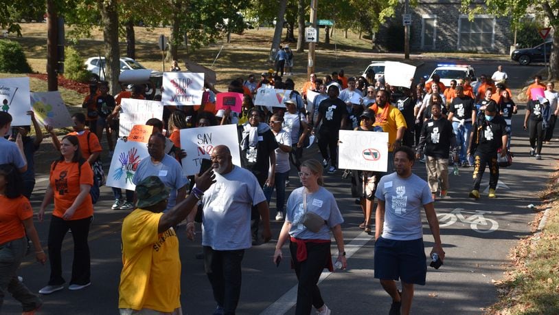 Kids, teens and adults marched down Broadway Street in northwest Dayton on Thursday, Sept. 19, 2024, as part of a peace march and rally in response to an increase in gun violence in the community. CORNELIUS FROLIK / STAFF