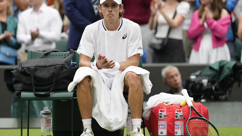 Alex de Minaur of Australia reacts following his fourth round win over Arthur Fils of France at the Wimbledon tennis championships in London, Monday, July 8, 2024. (AP Photo/Alberto Pezzali)