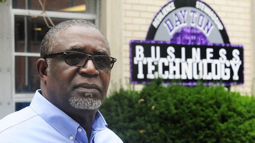 Don Jasmin, superintendent of the Dayton Business Technology High school, a dropout prevention charter school in West Dayton, stands in front of the building. The Dayton Business Technology High School received a $172,000 state grant to expand their career technology offerings. Marshall Gorby/ Staff