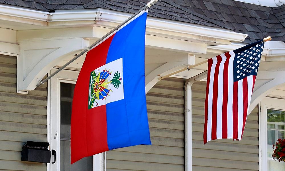 A residence along North Limestone Street in Springfield was flying the Haitian flag along side the American flag Wednesday, May 10, 2023. BILL LACKEY/STAFF