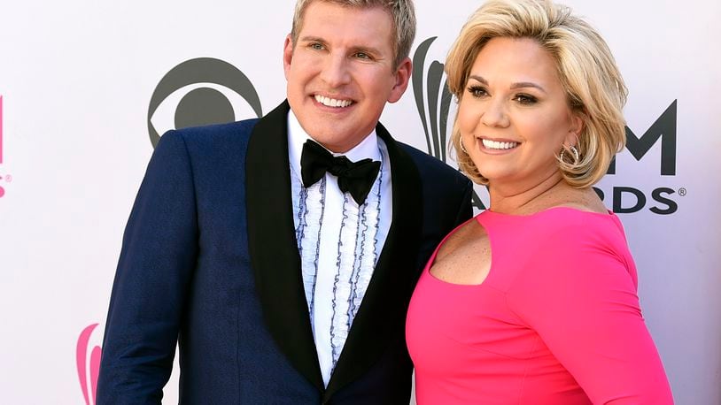 FILE - Todd Chrisley, left, and his wife, Julie Chrisley, pose for photos at the 52nd annual Academy of Country Music Awards on April 2, 2017, in Las Vegas. Reality TV star Julie Chrisley's sentence for bank fraud and tax evasion has been thrown out by federal appeals judges, who have ordered a lower court to redo her punishment, Friday, June 21, 2024.(Photo by Jordan Strauss/Invision/AP, File)